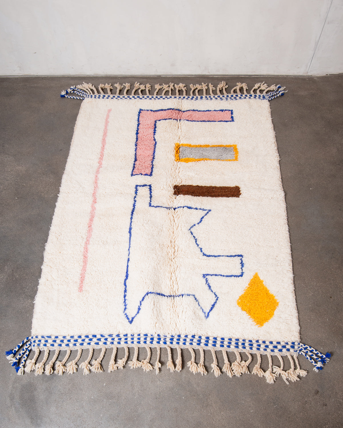 Modern, designer, handcrafted Berber rug from Morocco. Beniourain carpet with beautiful colours and patterns and fluffy wool texture.